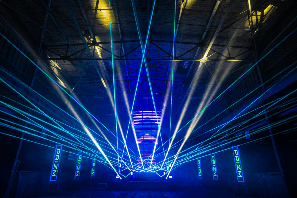 Stage with lasers led wall and tube lights, blue light theme Prizm production logo